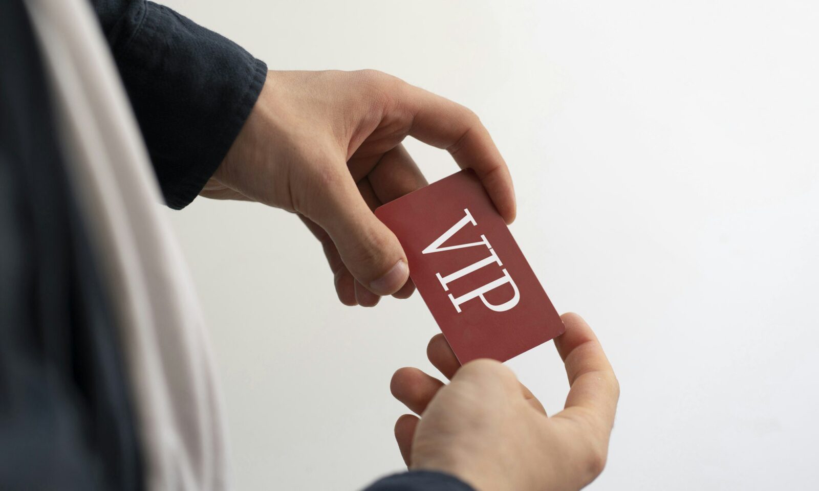 a-person-showing-vip-card-pass-exclusive-access-membership