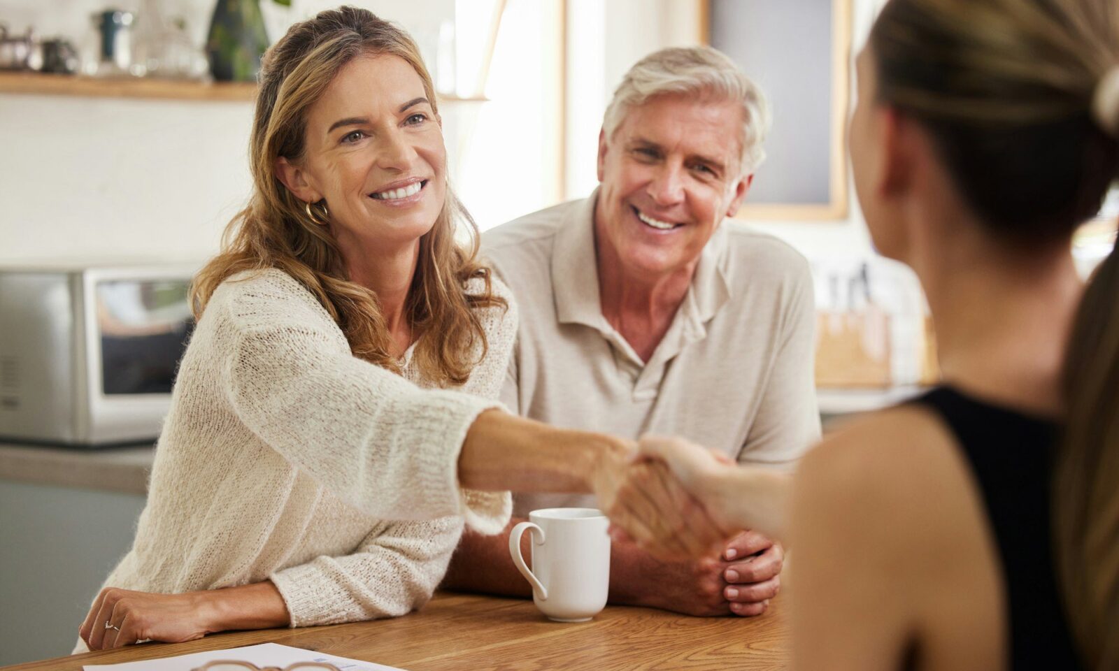handshake-life-insurance-and-senior-couple-with-lawyer-for-mortgage-tax-bills-property-and-financ