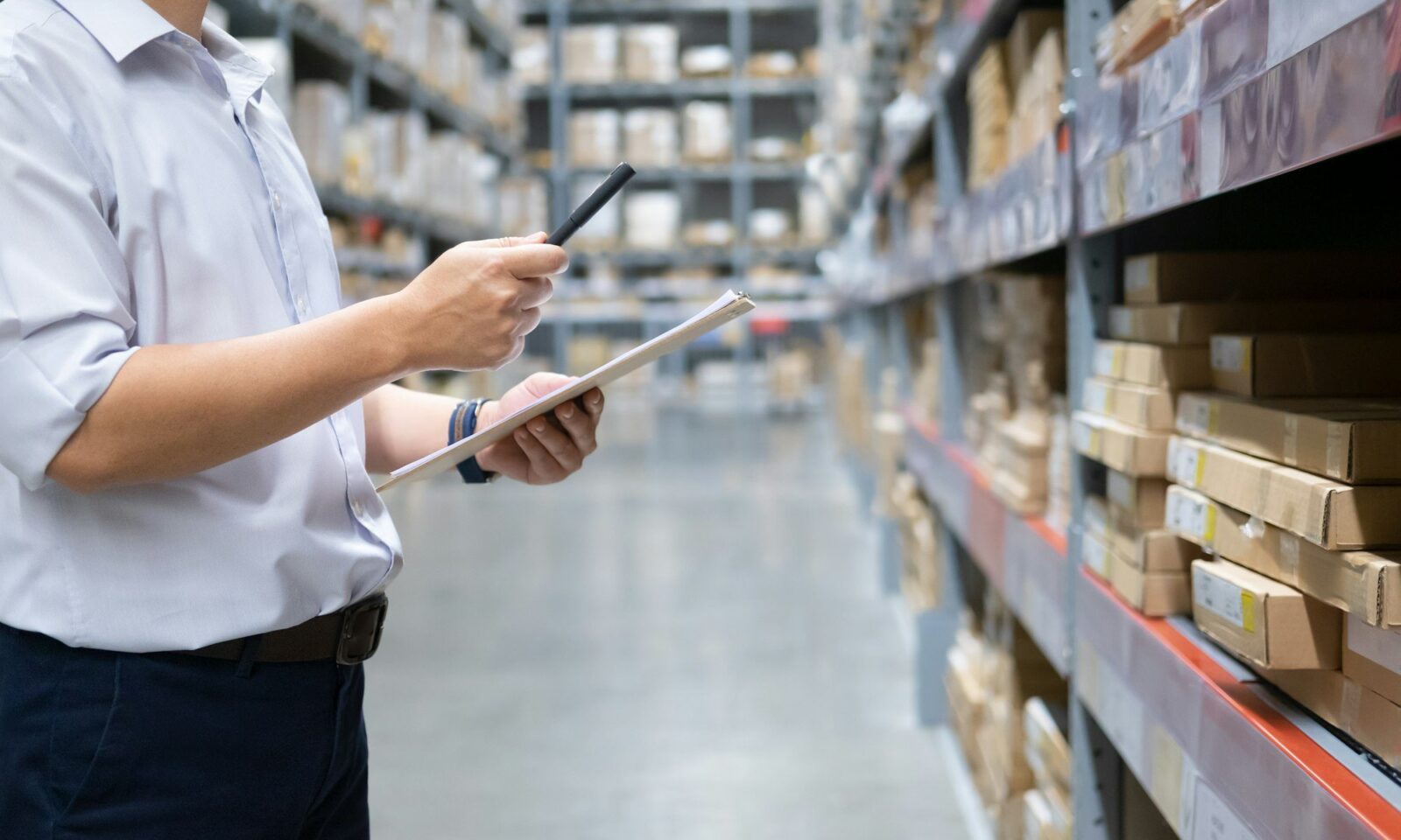 man-warehouse-worker-checking-goods-at-warehouse-